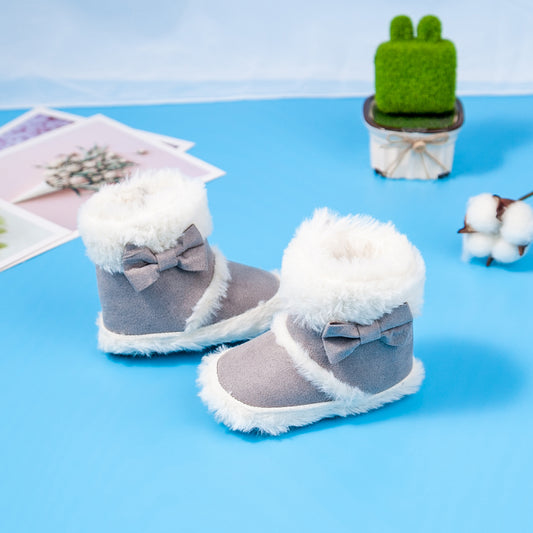 Pantufas de bebé com detalhe de laço e pele sintética