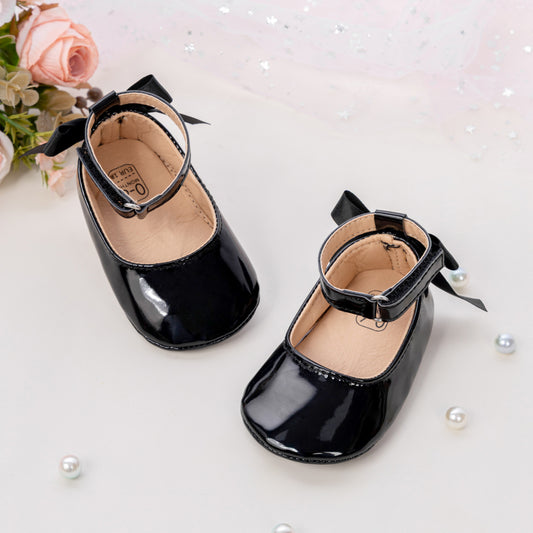 Sapatos de bebé com detalhe de laço elegante