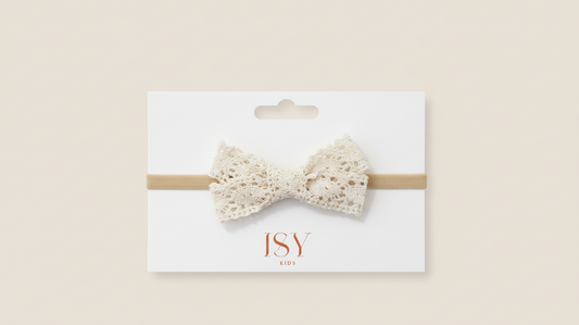 Elegante faixa de cabeça com laço de renda para bebé